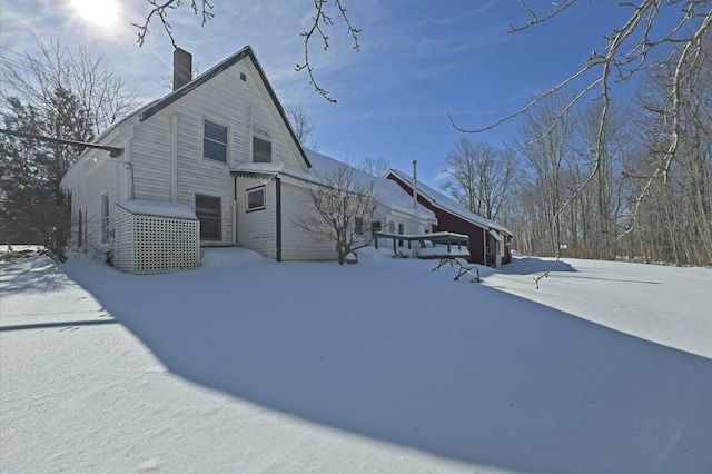 exterior space featuring a chimney