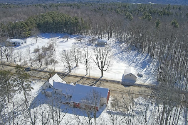 snowy aerial view with a view of trees