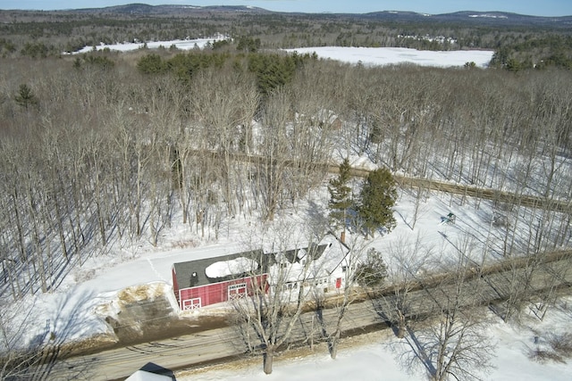 snowy aerial view with a mountain view