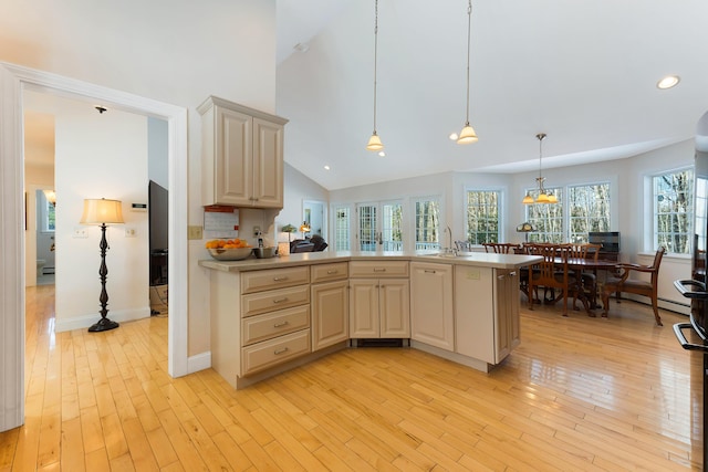 23 Sunny Acres Ln, Boothbay, ME 04537 - kitchen featuring light wood-style floors, light countertops, recessed lighting, high vaulted ceiling, and a peninsula