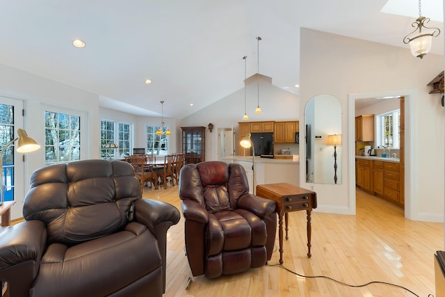23 Sunny Acres Ln, Boothbay, ME 04537 - living room with light wood-style flooring, recessed lighting, a chandelier, and high vaulted ceiling