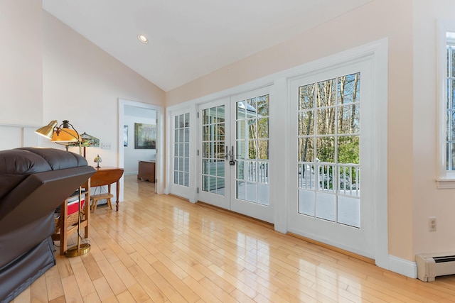 23 Sunny Acres Ln, Boothbay, ME 04537 - entryway featuring french doors, wood finished floors, lofted ceiling, a baseboard heating unit, and baseboards