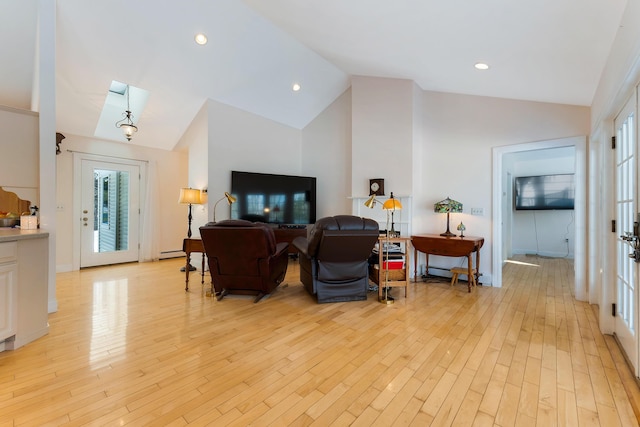 23 Sunny Acres Ln, Boothbay, ME 04537 - living area featuring light wood-style flooring, high vaulted ceiling, and baseboard heating