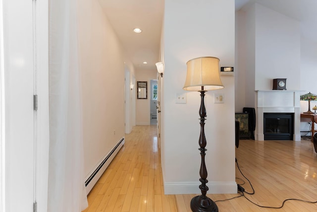 23 Sunny Acres Ln, Boothbay, ME 04537 - corridor with a baseboard radiator, light wood finished floors, recessed lighting, and baseboards