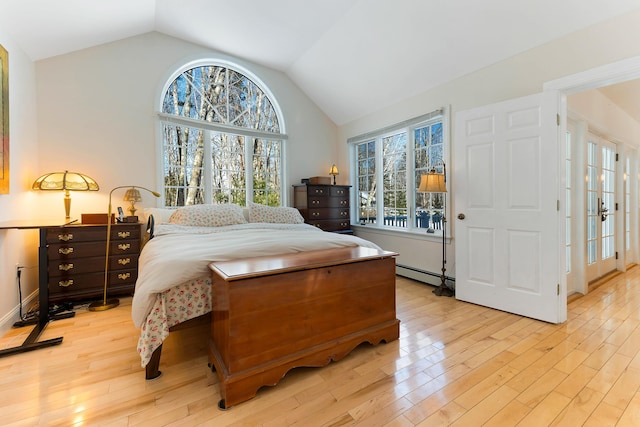 23 Sunny Acres Ln, Boothbay, ME 04537 - bedroom with a baseboard heating unit, light wood-type flooring, and lofted ceiling