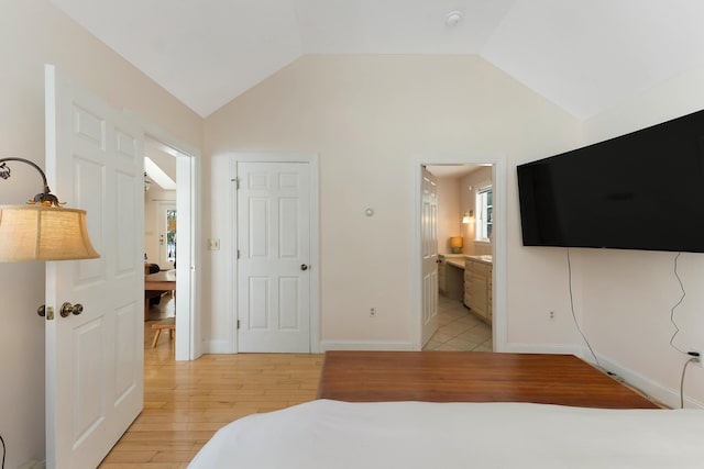 23 Sunny Acres Ln, Boothbay, ME 04537 - bedroom featuring light wood finished floors, lofted ceiling, baseboards, and ensuite bath