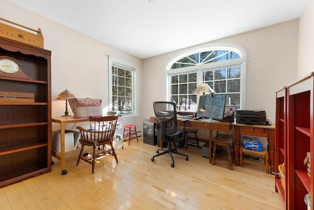 23 Sunny Acres Ln, Boothbay, ME 04537 - office area featuring wood finished floors and a baseboard heating unit
