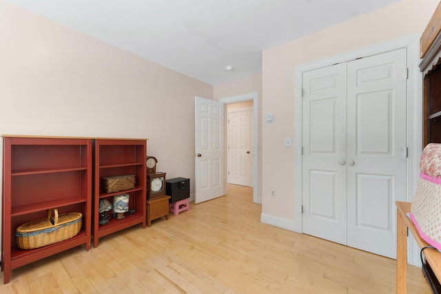 23 Sunny Acres Ln, Boothbay, ME 04537 - bedroom with light wood finished floors, a closet, and baseboards