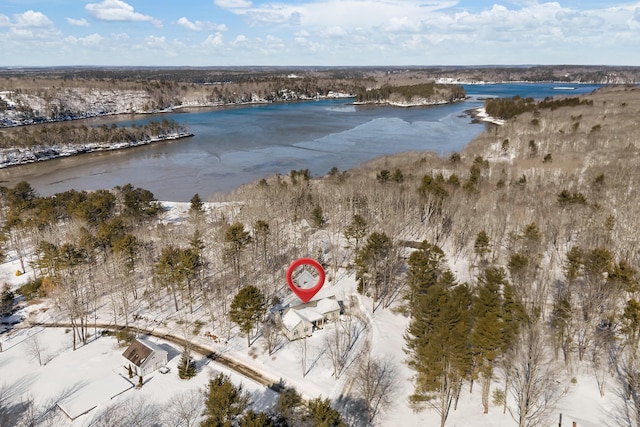 snowy aerial view featuring a water view