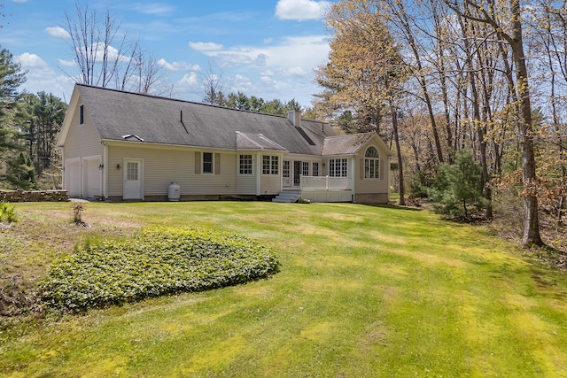 23 Sunny Acres Ln, Boothbay, ME 04537 - back of property with a yard, a chimney, a garage, and a wooden deck