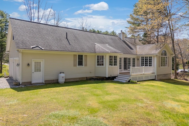 23 Sunny Acres Ln, Boothbay, ME 04537 - rear view of house with a chimney, a lawn, a wooden deck, and a shingled roof