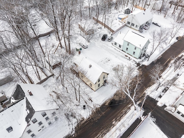 snowy aerial view with a residential view