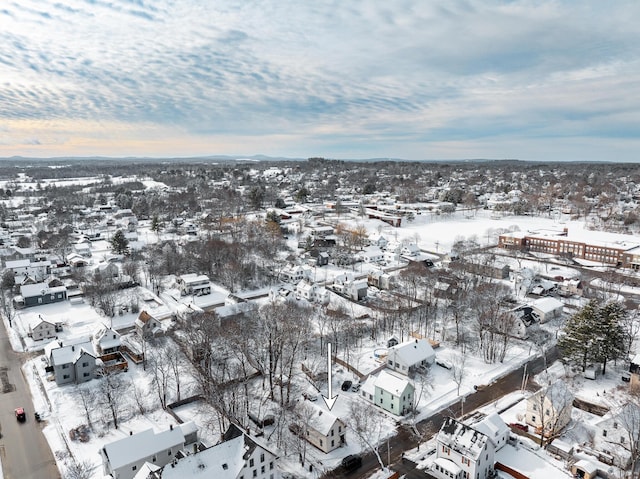 snowy aerial view with a residential view