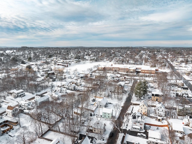 snowy aerial view featuring a residential view