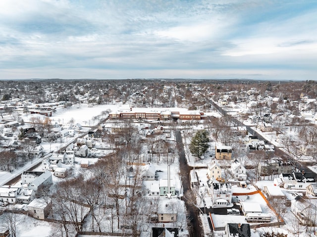 snowy aerial view featuring a residential view