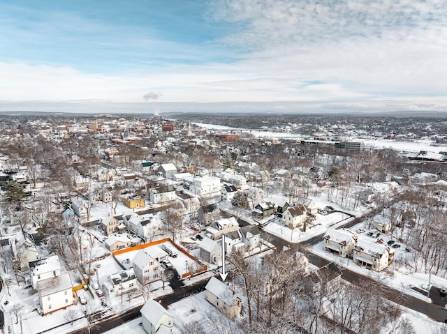 snowy aerial view featuring a residential view