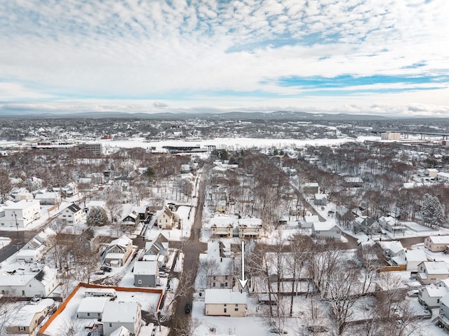 snowy aerial view featuring a residential view