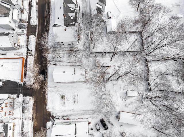 snowy aerial view with a residential view