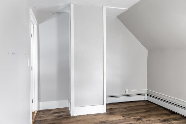 bonus room featuring vaulted ceiling and dark wood-type flooring