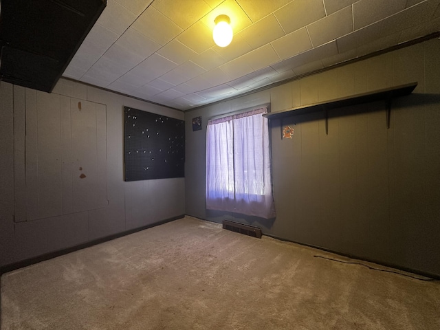 unfurnished room featuring visible vents and carpet flooring