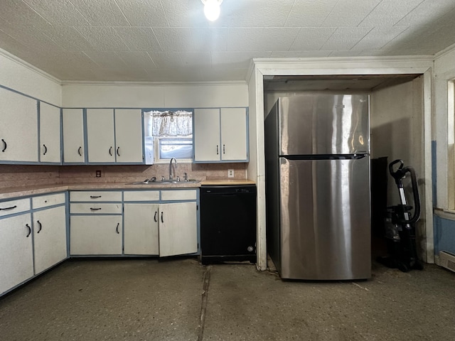 kitchen with black dishwasher, crown molding, freestanding refrigerator, white cabinetry, and a sink