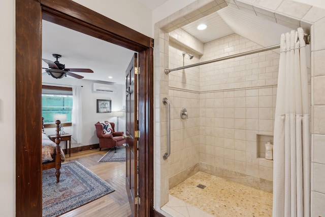 bathroom featuring a wall mounted air conditioner, connected bathroom, a tile shower, ceiling fan, and recessed lighting