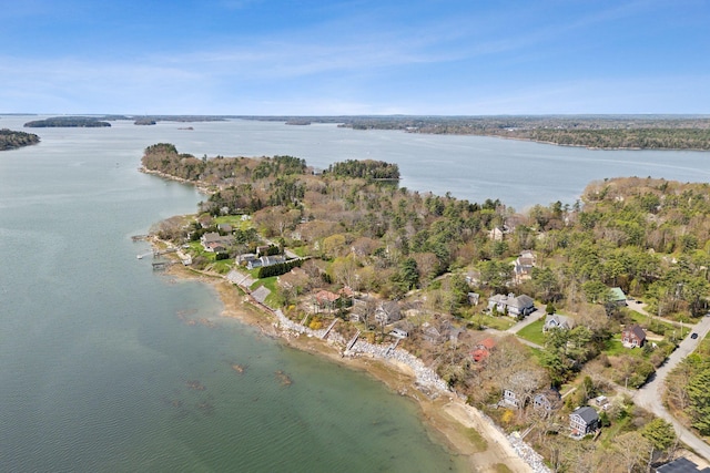 aerial view of property and surrounding area with a nearby body of water