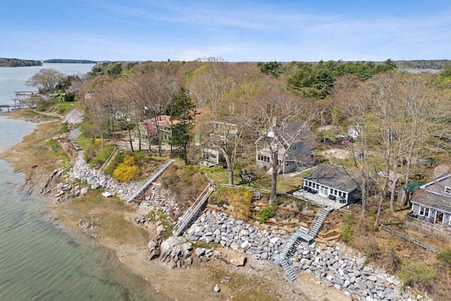aerial view of property's location with a nearby body of water
