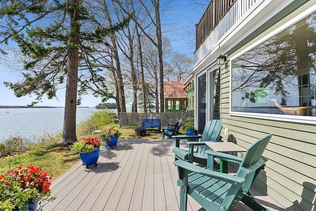 wooden deck with a water view