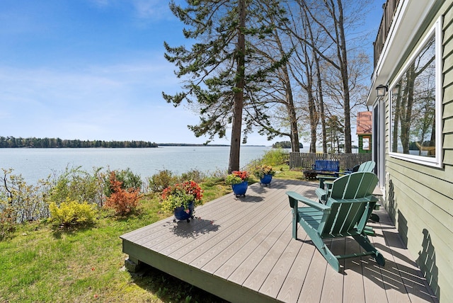 wooden terrace with a water view