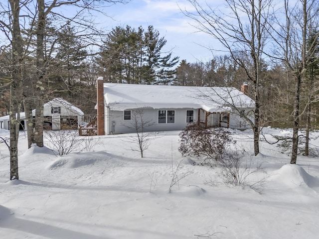 view of front of home with a chimney