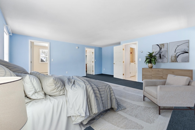 bedroom featuring carpet floors and ensuite bathroom