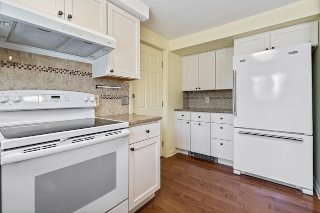 kitchen featuring decorative backsplash, range hood, white appliances, white cabinetry, and dark wood-type flooring