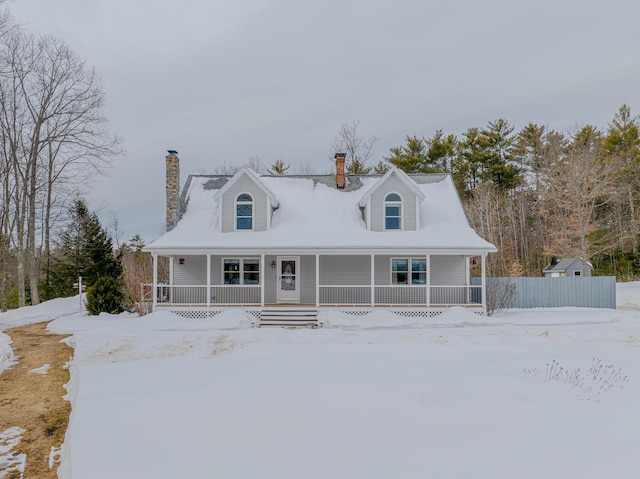 view of front facade with a porch and a chimney