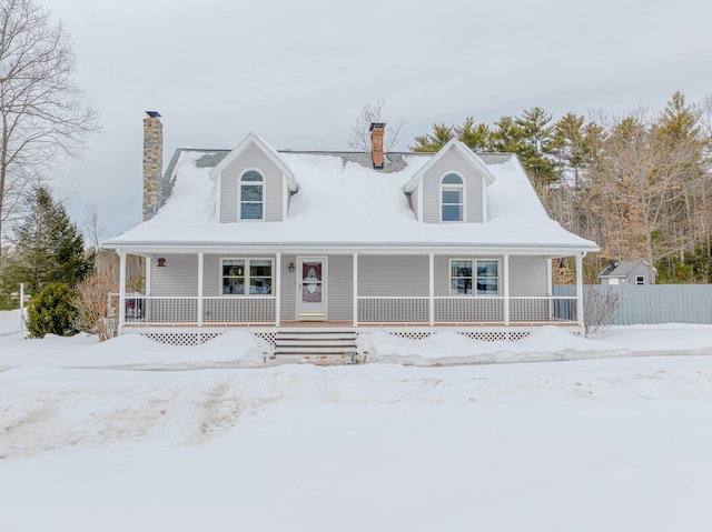 view of front of house with a porch and a chimney