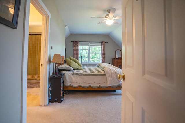 carpeted bedroom with lofted ceiling and ceiling fan