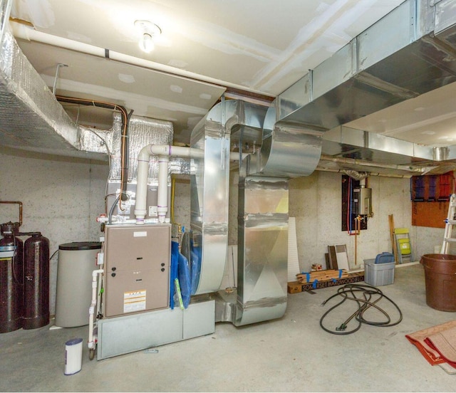 utility room featuring water heater