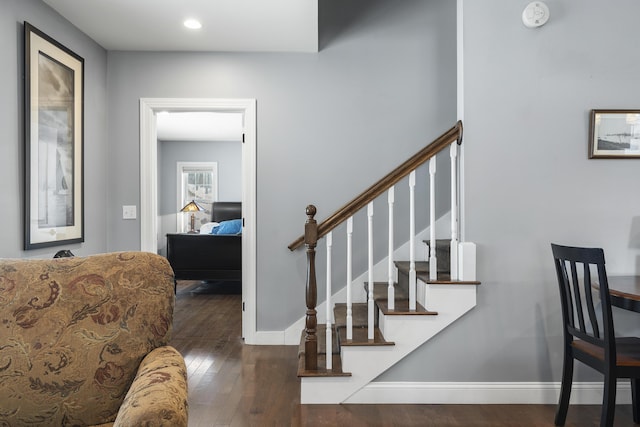 stairway featuring recessed lighting, baseboards, and hardwood / wood-style floors