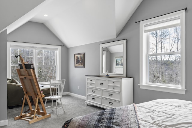 bedroom featuring lofted ceiling, baseboards, and carpet flooring