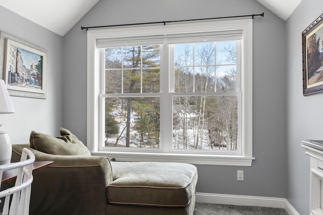 sitting room with visible vents, baseboards, vaulted ceiling, and carpet flooring