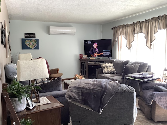 living room with a textured ceiling, a wall unit AC, and a fireplace