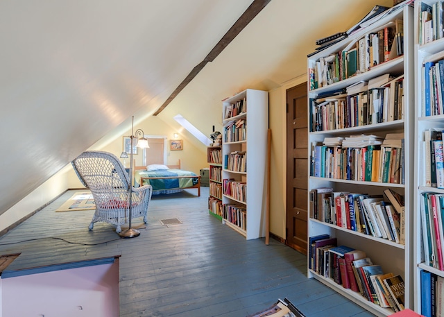 living area featuring lofted ceiling and wood-type flooring