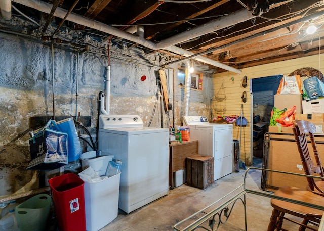 unfinished basement with washer and clothes dryer