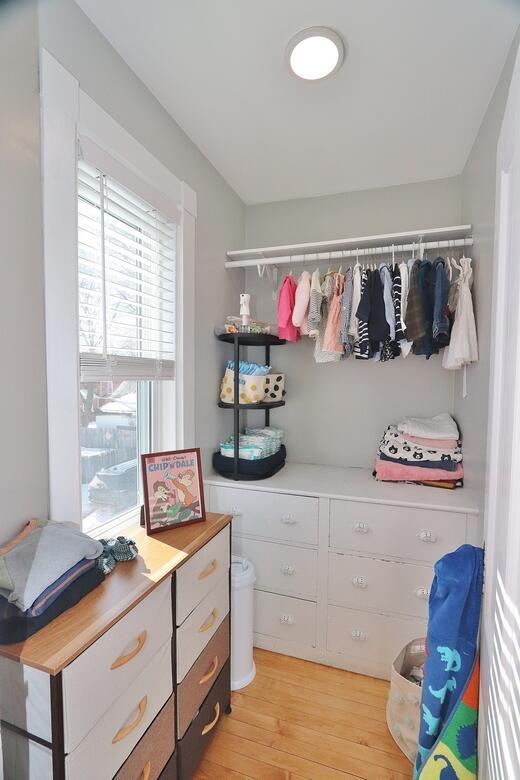 walk in closet with light wood-type flooring