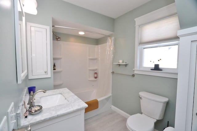 full bathroom featuring shower / tub combo with curtain, toilet, vanity, wood finished floors, and baseboards