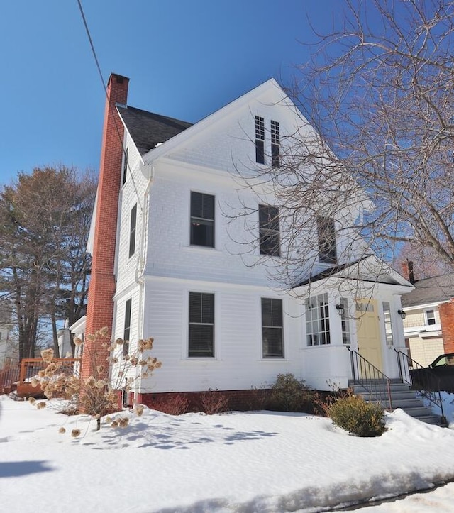 view of front of property featuring a chimney