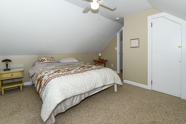 bedroom with lofted ceiling, ceiling fan, baseboards, and light colored carpet