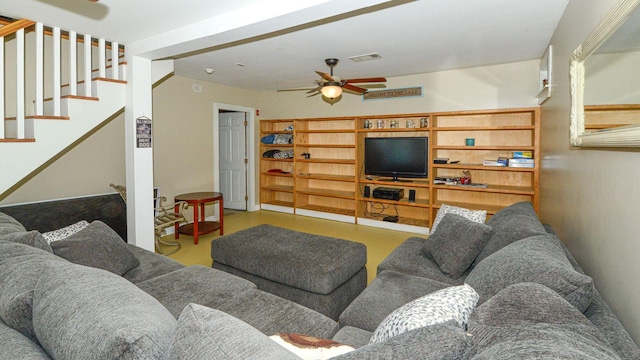 living area featuring stairway, visible vents, ceiling fan, and finished concrete flooring