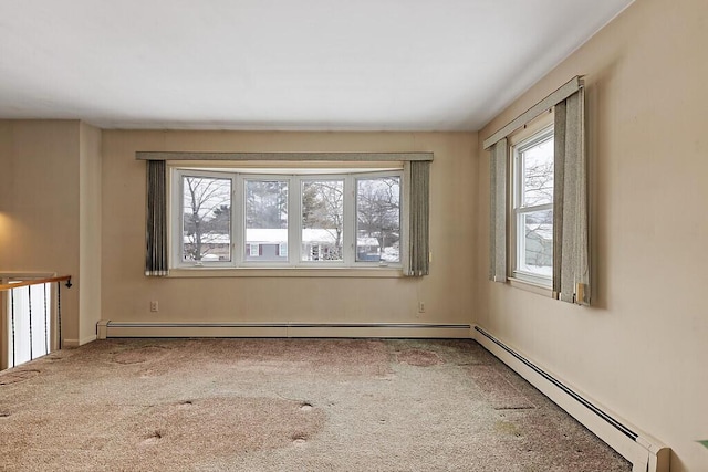 unfurnished room with carpet and a baseboard heating unit