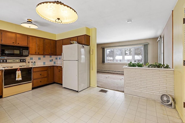 kitchen with a baseboard radiator, white appliances, visible vents, light countertops, and backsplash